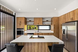 Modern Kitchen with Open Layout and High-End Appliances in Pacifico Resort Home