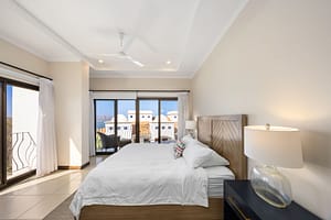Master bedroom with ocean view and hardwood furnishings at Flamingo Towers 11, Playa Flamingo.
