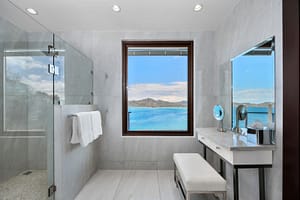Spa-like bathroom with a glass-enclosed shower, elegant vanity, and ocean views at 360 Splendor del Pacifico Flamingo.