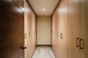 Spacious walk-in closet at Casa Kenya, featuring custom shelving, elegant lighting, and ample storage in Hacienda Pinilla, Costa Rica.