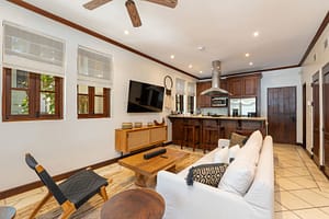 Elegant ocean-view living room with seamless indoor-outdoor design at 9 Paseo del Mar, Las Catalinas.