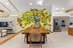 Stylish dining area at Casa Artistica, featuring a spacious layout, elegant furnishings, and seamless indoor-outdoor flow for a perfect dining experience.