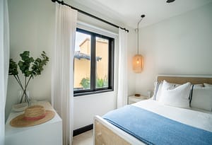 Bright and airy bedroom with private balcony overlooking Las Catalinas town at 18 Calle La Ronda Costa Rica home for sale