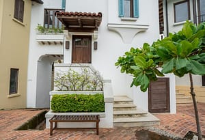 Back view of 9 Calle La Ronda, Las Catalinas, showcasing its multiple levels and connection to the coastal landscape.