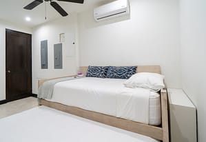 Bright and airy bedroom with private balcony overlooking Las Catalinas town at 18 Calle La Ronda Costa Rica home for sale