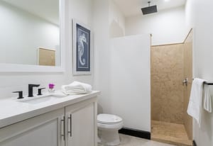 Modern bathroom with bright finishes and walk in shower at 18 Calle La Ronda Las Catalinas Costa Rica Elegant bath with natural stone accents and fresh design at 18 Calle La Ronda steps from Playa Danta