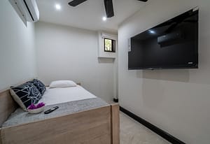 Bright and airy bedroom with private balcony overlooking Las Catalinas town at 18 Calle La Ronda Costa Rica home for sale Spacious guest bedroom with fresh finishes and natural light at 18 Calle La Ronda steps from Playa Danta