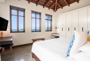 Elegant master bedroom at 9 Calle La Ronda, Las Catalinas with ocean views and modern design.