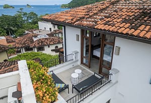 Ocean-view balcony with outdoor seating at 9 Calle La Ronda, Las Catalinas