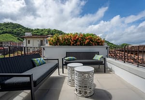Ocean-view balcony with outdoor seating at 9 Calle La Ronda, Las Catalinas