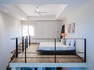 Elegant and spacious bedroom at Casa Kenya, featuring luxurious bedding, modern decor, and serene tropical views in Hacienda Pinilla, Costa Rica.
