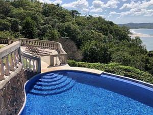 Sparkling pool at Flamingo Towers, Playa Flamingo, Costa Rica, offering a refreshing retreat with ocean views.