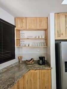 Modern gourmet kitchen in Villa Praga, Playa Grande, featuring high-end appliances, sleek cabinetry, and a spacious island.